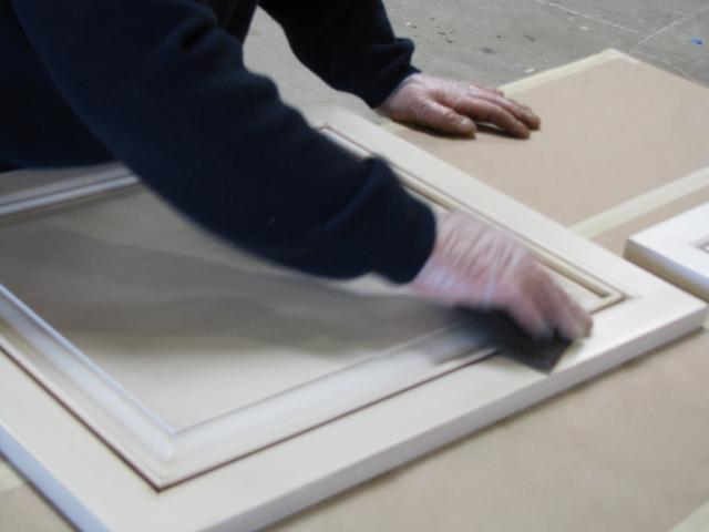 Man Finishing a Wooden Board