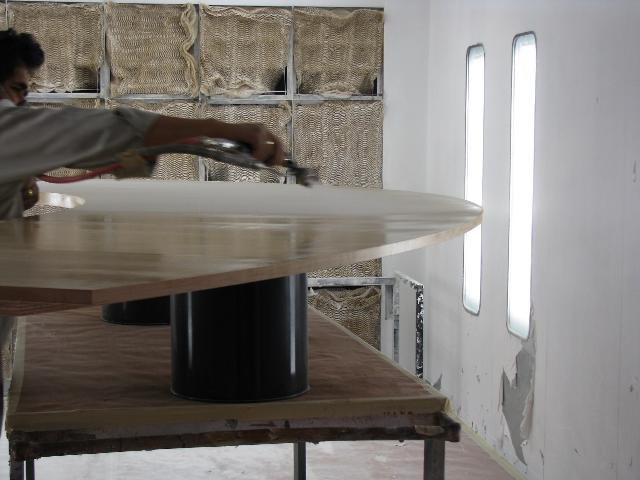 A Person Clean the Wooden Table